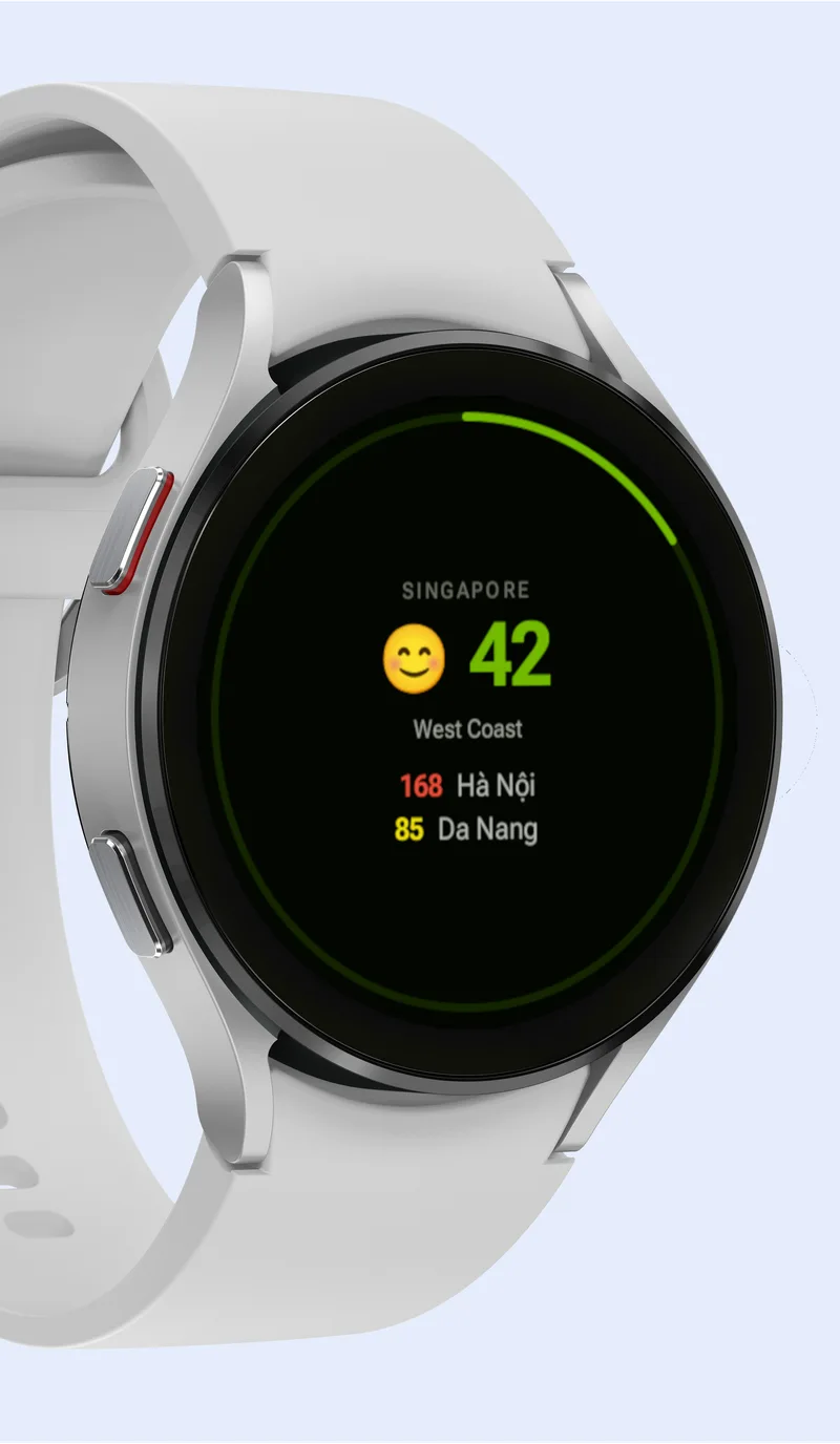 White Wear OS watch displaying the AirWear Pro tile: Singapore 42, Hanoi 168, Da Nang 85