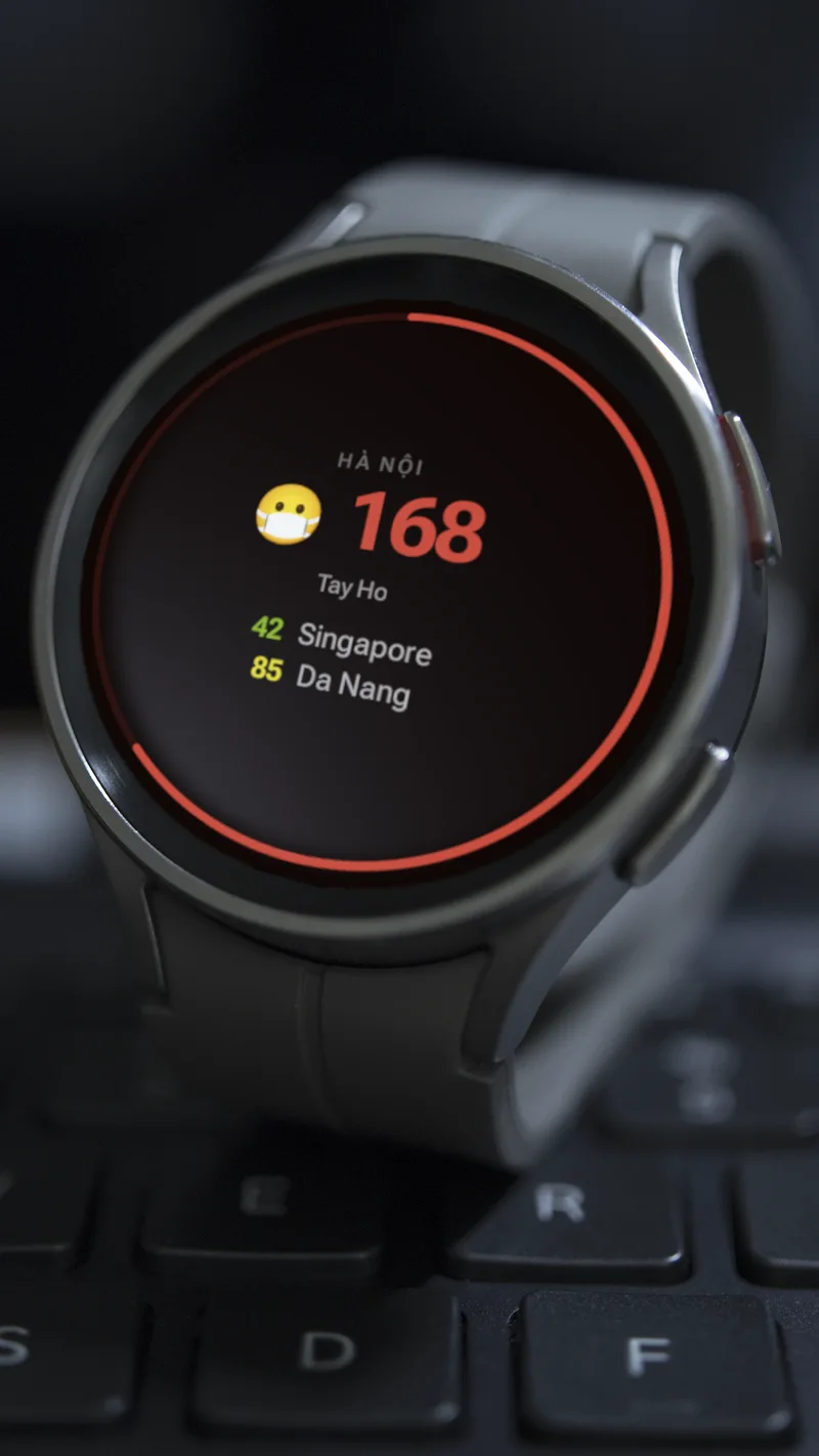 AirWear running on a real black Wear OS watch with AQI readings for Hanoi, Singapore and Da Nang